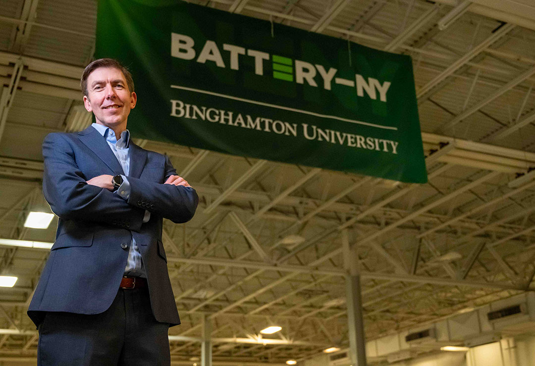 Paul Malliband, Executive Director of Battery-NY, looks off into distance as though into the future, set in industrial space meant for future battery technology and manufacturing prototyping.